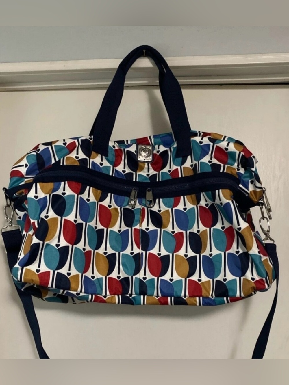 Brighton Newberry Round Tripper duffel bag vibrant, multi-colored tulip pattern